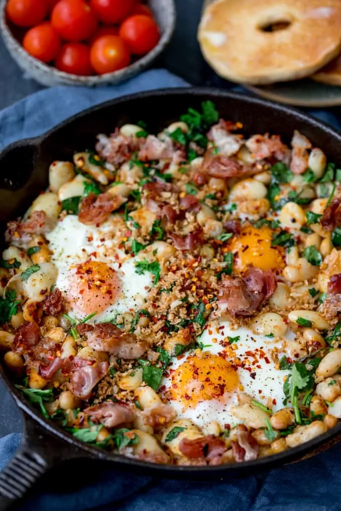 https://www.kitchensanctuary.com/wp-content/uploads/2017/10/Spicy-Egg-Breakfast-with-Smashed-Beans-and-Pancetta-recipe-tall-FS.webp