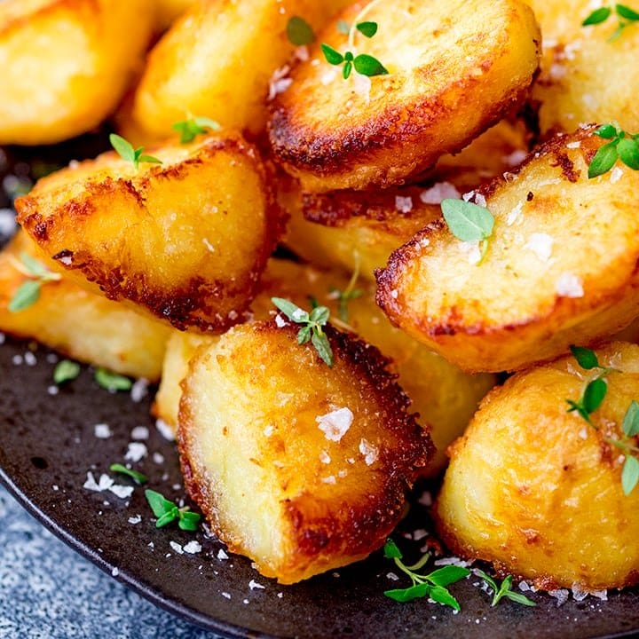 https://www.kitchensanctuary.com/wp-content/uploads/2019/04/Roast-potatoes-with-salt-and-fresh-thyme-leaves-square-FS.jpg