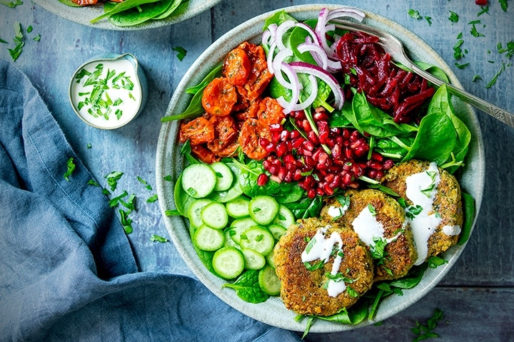 https://www.kitchensanctuary.com/wp-content/uploads/2019/08/Falafel-salad-bowl-with-pomegranate-and-feta-dressing-wide-FS.jpg