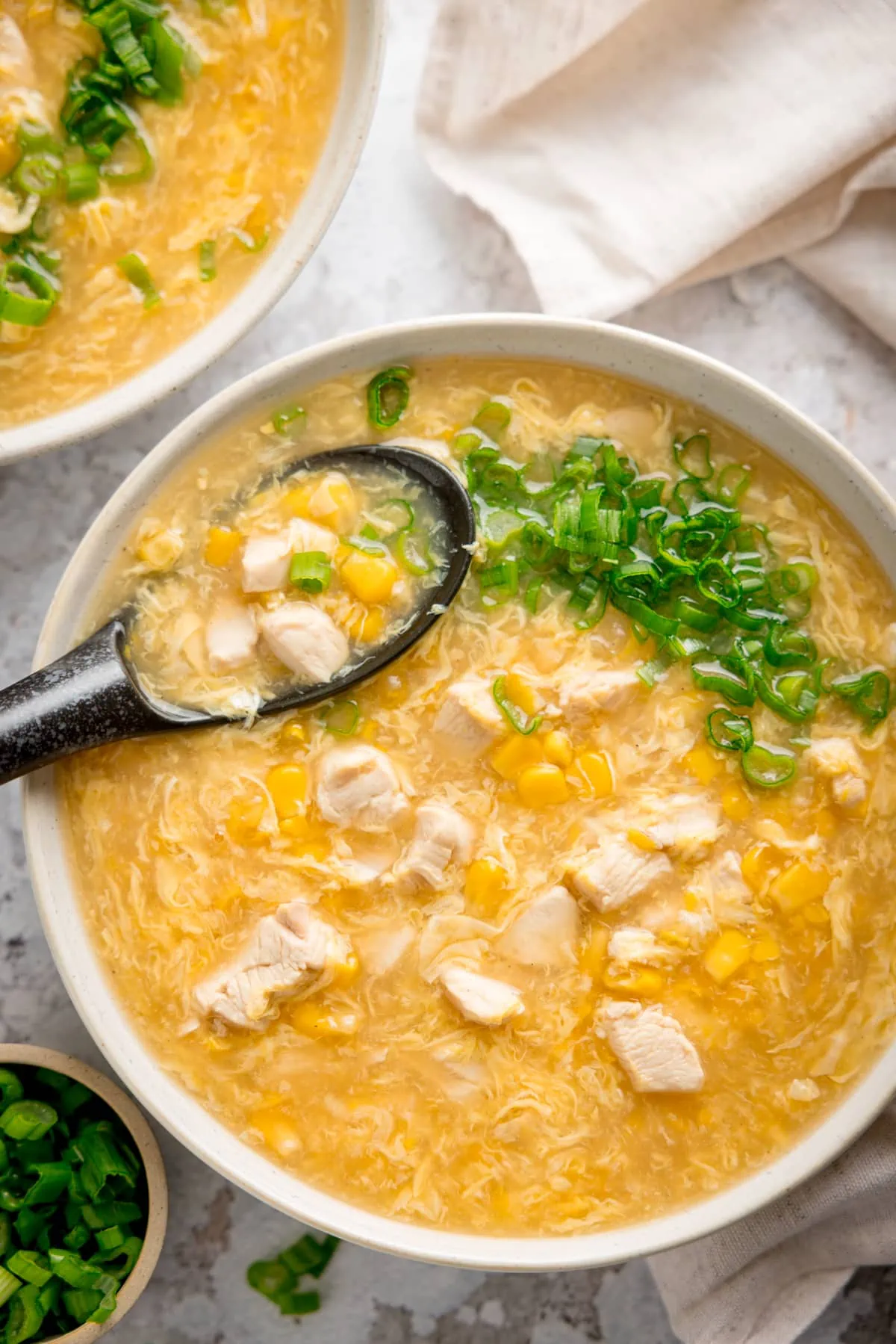 https://www.kitchensanctuary.com/wp-content/uploads/2023/06/Chicken-and-Sweetcorn-Soup-tall-FS.webp